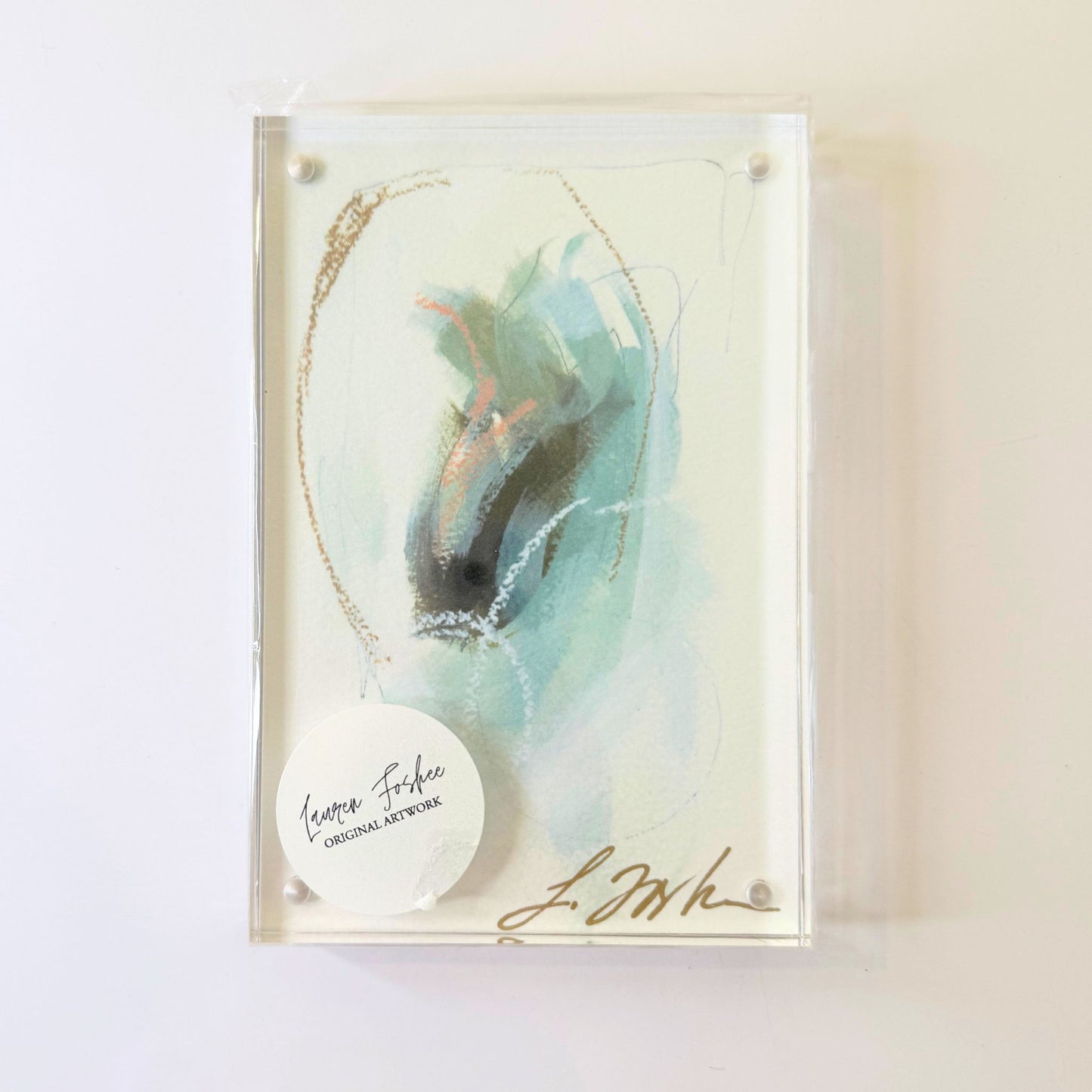 Lauren Foshee signed watercolor print, loose abstract brushwork in teal and blue with coral and gold thread detail, in a clear acrylic floating frame