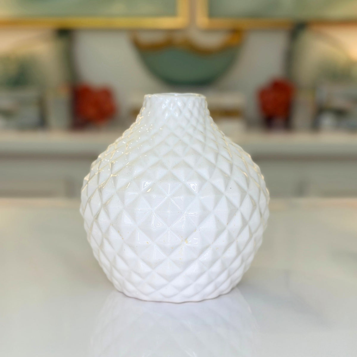 Short white textured bud vase with ribbed texture