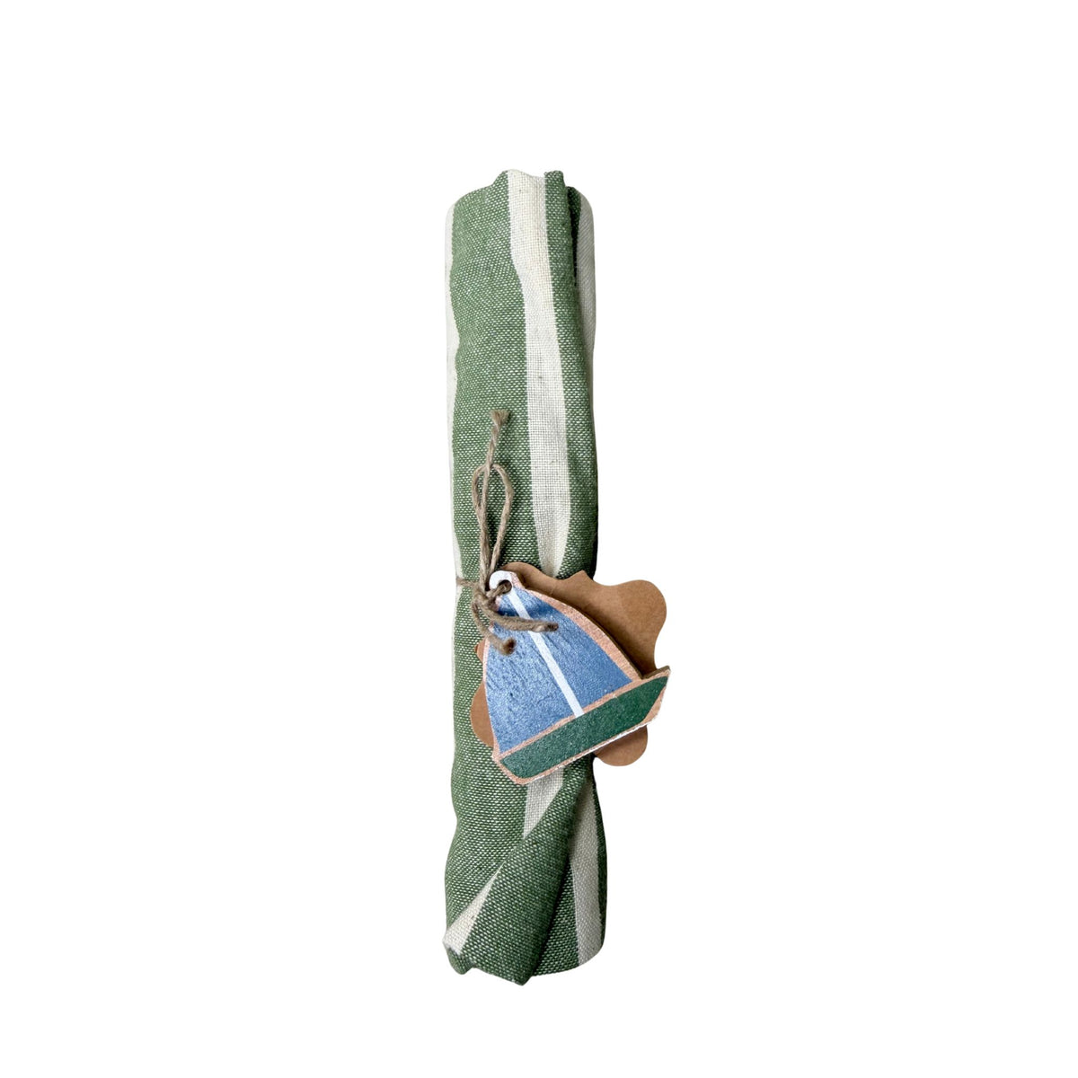 A rolled cream and green striped linen tea towel tied with jute twine and a hand-painted wooden sailboat charm.
