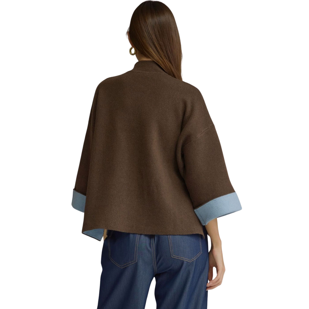 Back view of a brown swing sweater top showing the relaxed boxy fit and light blue contrast cuffs.