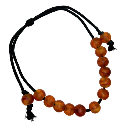 Ball on Cord Necklace, close-up of beads on cord