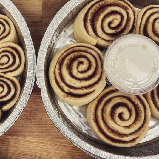 Classic cinnamon rolls, baked with icing drizzled on top