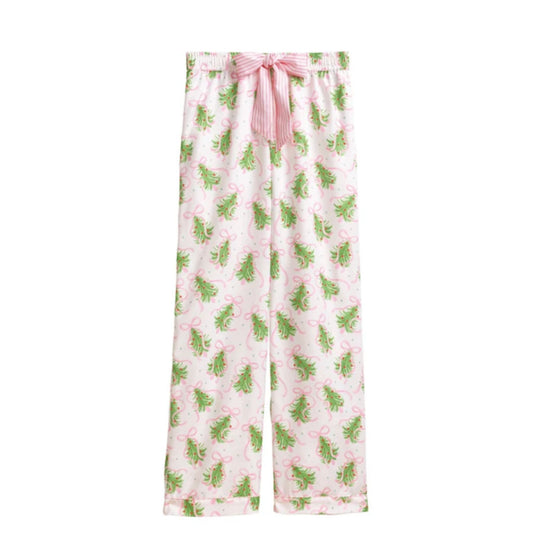 Close-up of ivory pajama pants printed with green Christmas trees and pink bows, with a pink striped tie at the waist.