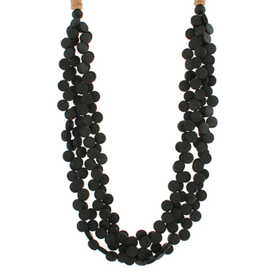 Multi-strand necklace of black disk beads in a long, layered length.