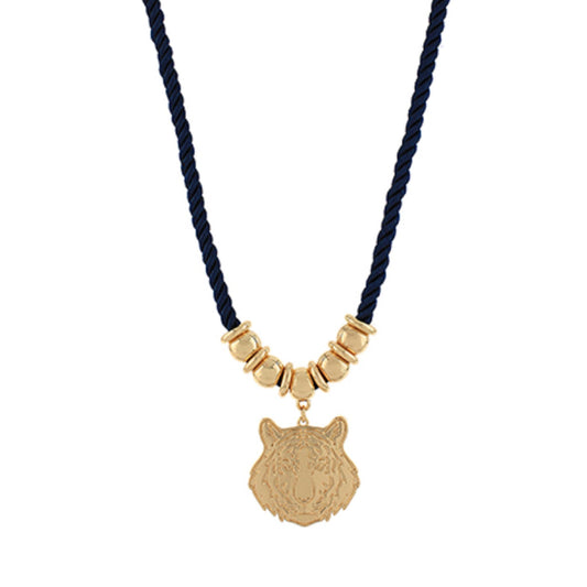 Navy cord necklace with gold beads and a gold tiger head pendant.