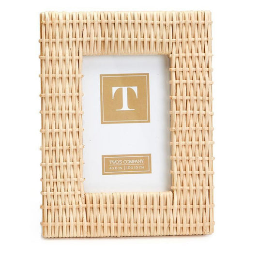 A criss-cross woven rattan photo frame in a natural finish, shown front-facing with a blank white insert.
