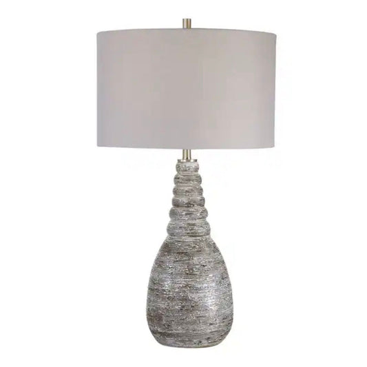 Rust brown ceramic table lamp with a light grey linen drum shade