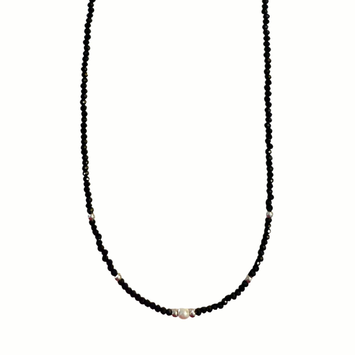 Black Beaded Necklace with Pearl Accents draped on a jewelry bust