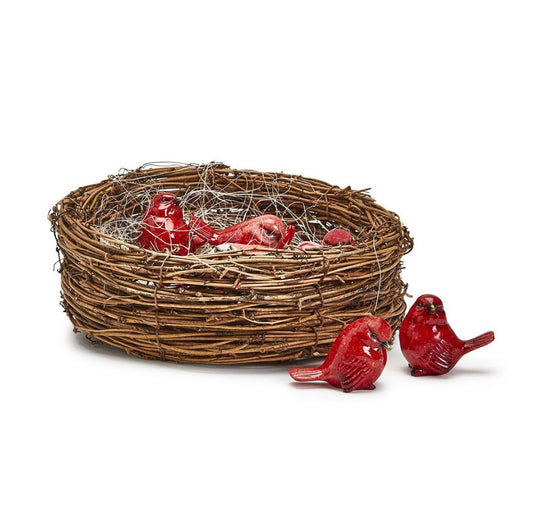 Woven bird nest with red birds on a white background
