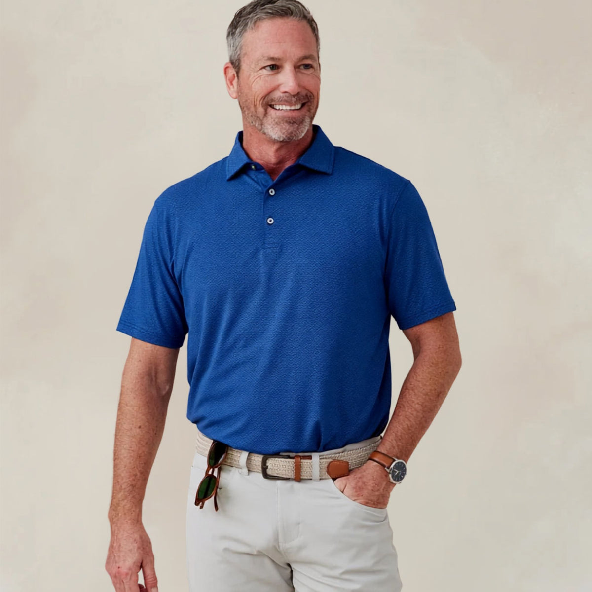 Men's polo shirt in a navy and white diamond-print pattern, embroidered with the Lake Martin logo at the chest.