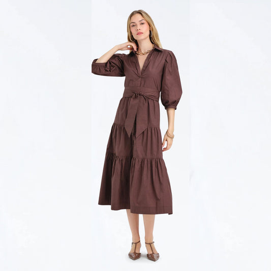 Woman wearing a cocoa brown tiered maxi shirtdress with puff sleeves, full-length front view