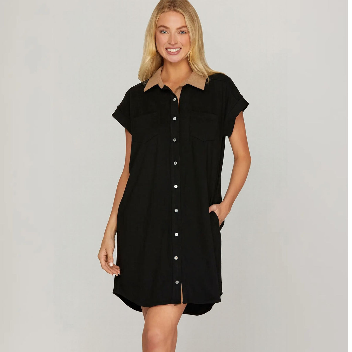 Black short-sleeve suede shirt dress with a button front and contrast collar, front view