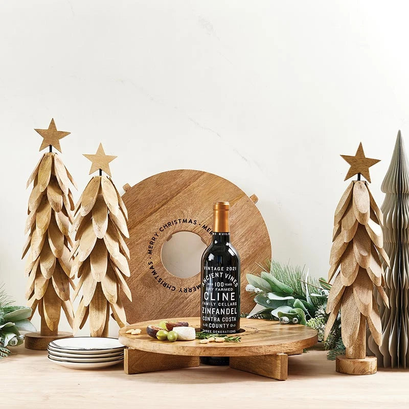 Driftwood-style Christmas tree styled on a charcuterie board with holiday spread