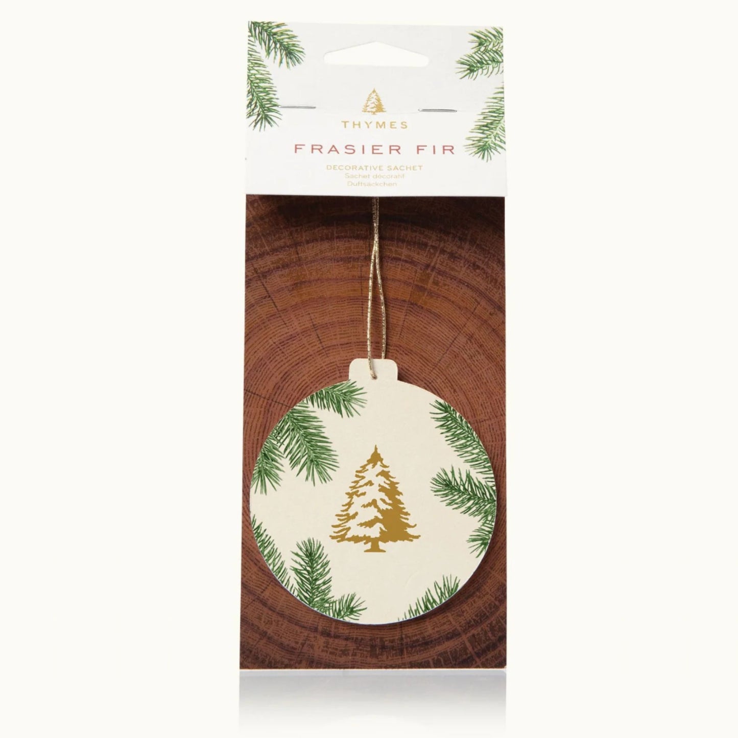 Frasier Fir decorative sachet ornament in its original retail packaging, cream ornament with gold pine tree design