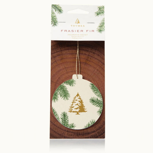 Frasier Fir decorative sachet ornament in its original retail packaging, cream ornament with gold pine tree design