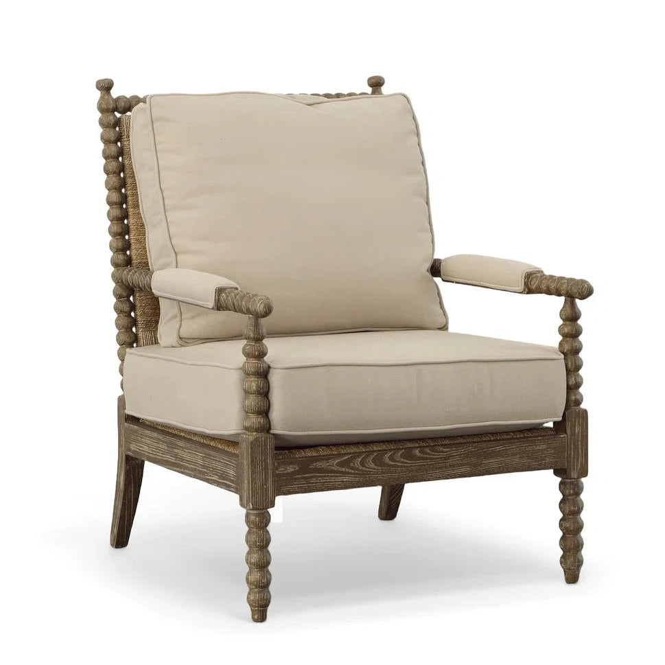 Beige cushioned armchair with wooden frame on a white background
