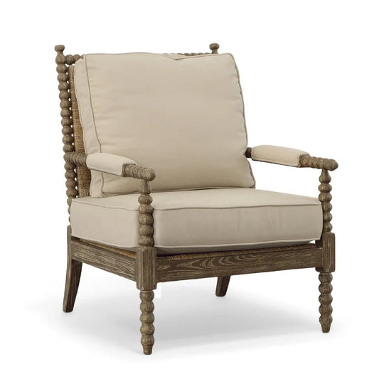 Beige cushioned armchair with wooden frame on a white background