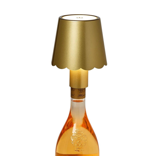 LED scalloped bottle lamp with a gold shade