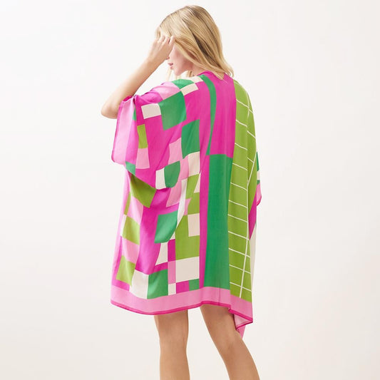 Back view of the geometric colorblock print kimono in pink and green, showing the full pattern and pink border.