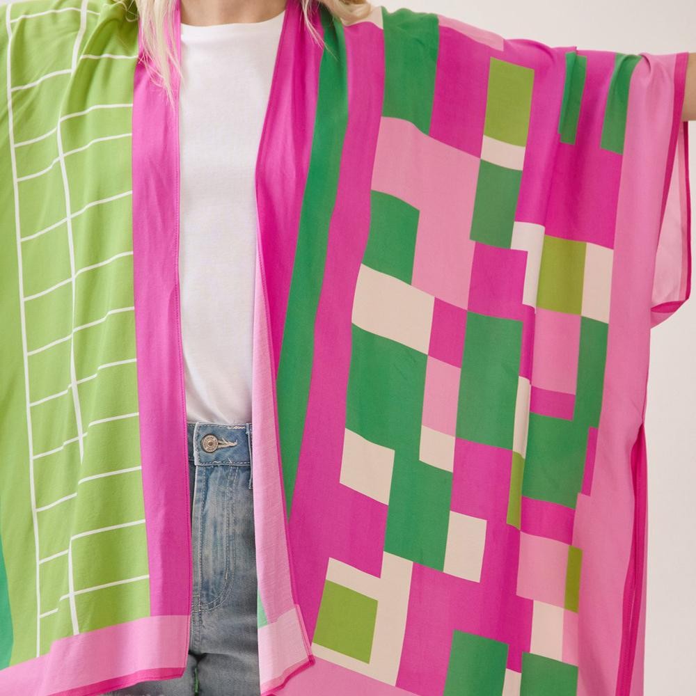 Close-up of the geometric colorblock print fabric in pink, green, and cream.