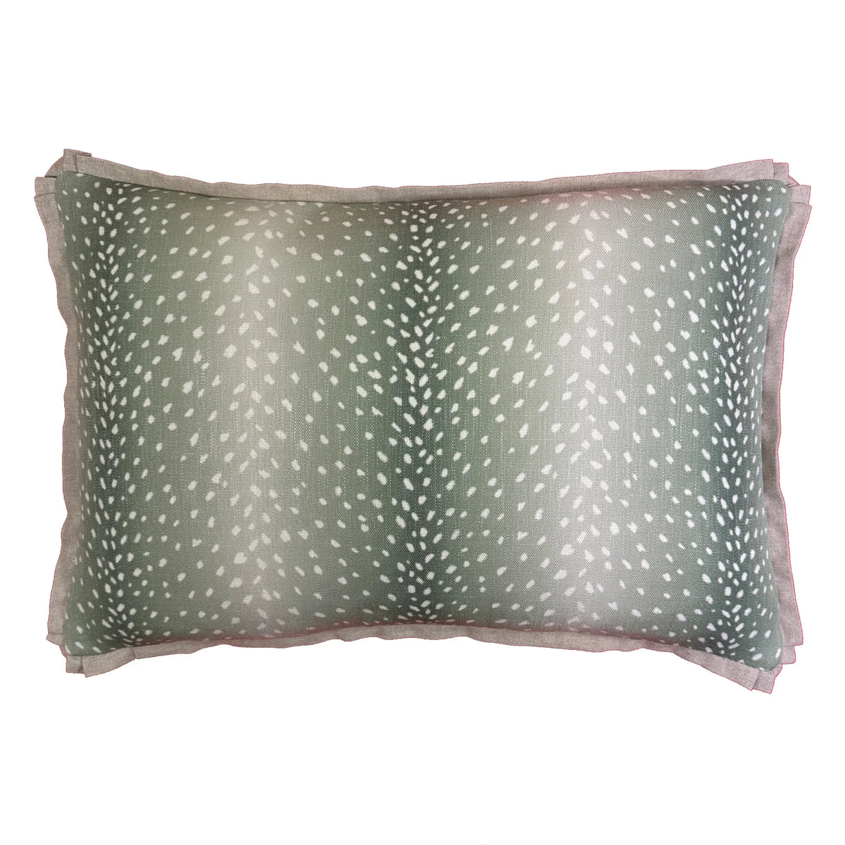Green and white Erindi Fern lumbar pillow, styled on a sofa