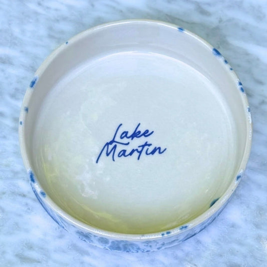 Handmade ceramic Lake Martin dish, shallow straight-sided bowl in cobalt-and-white waterfall glaze with hand-lettered "Lake Martin" inside
