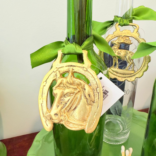 Vintage brass medallion with reindeer design and ribbon tie