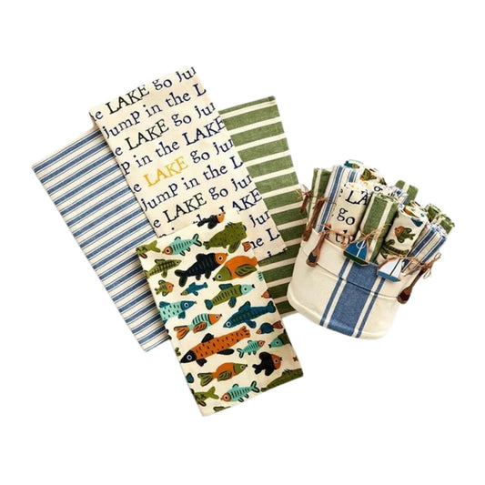 Stack of printed tea towels and cloth napkins in lake and nautical patterns