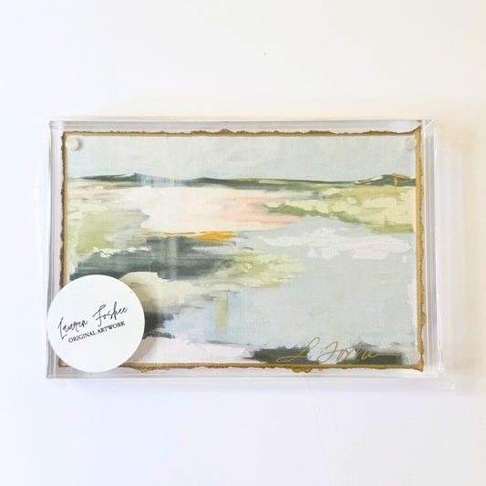 Lauren Foshee signed watercolor print, marsh landscape with soft green and pink sunset tones, in a clear acrylic floating frame