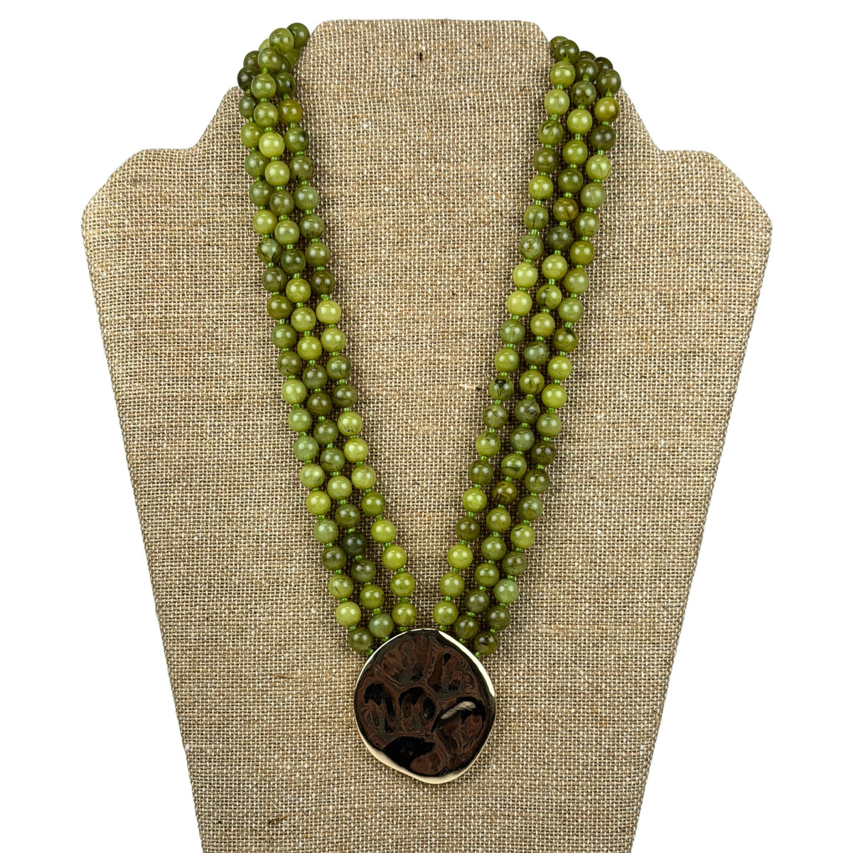 Layered Bead & Marble Necklace in green marbled beads with hammered gold medallion, front view