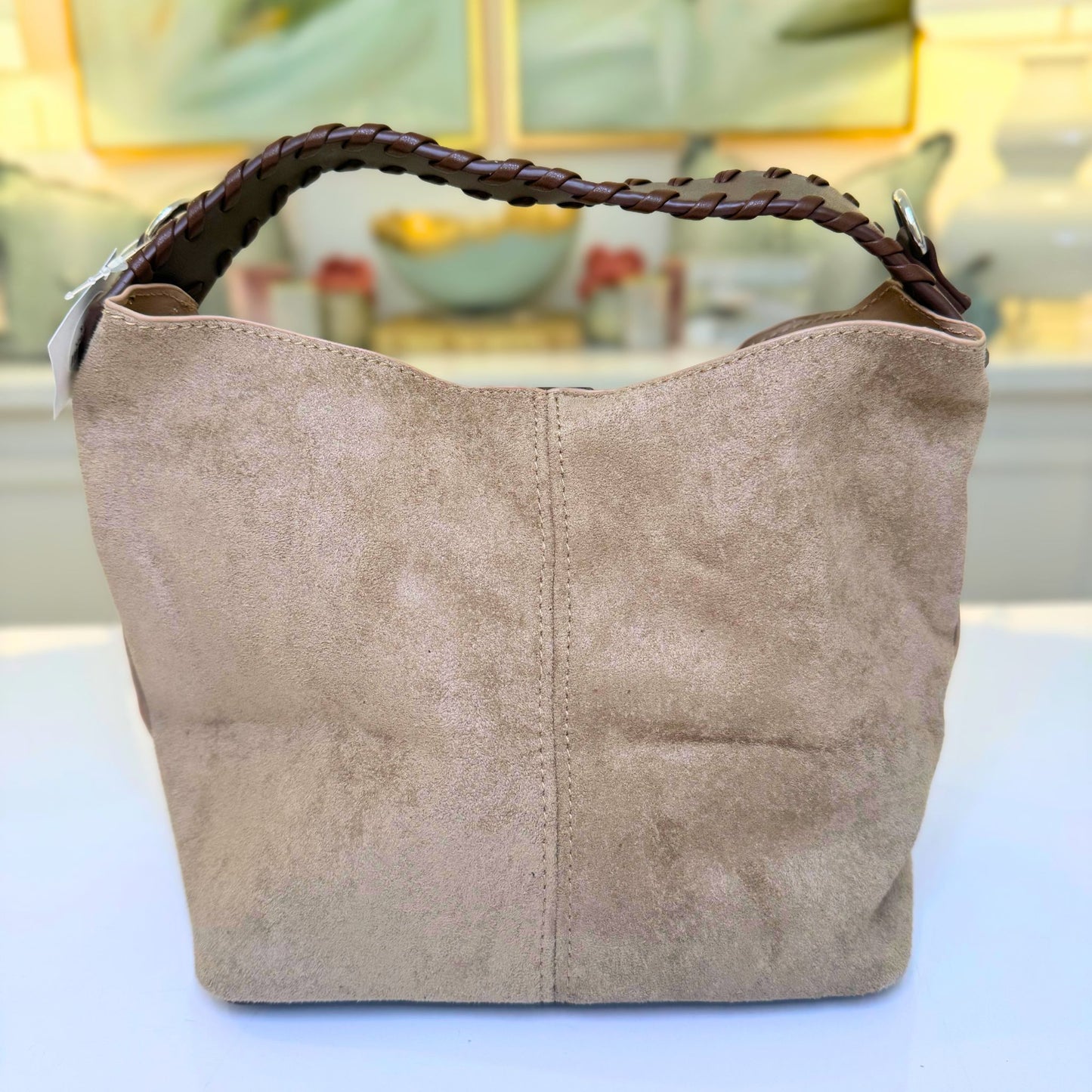 Khaki suede-like microfiber bucket bag with crossbody strap and matching removable pouch