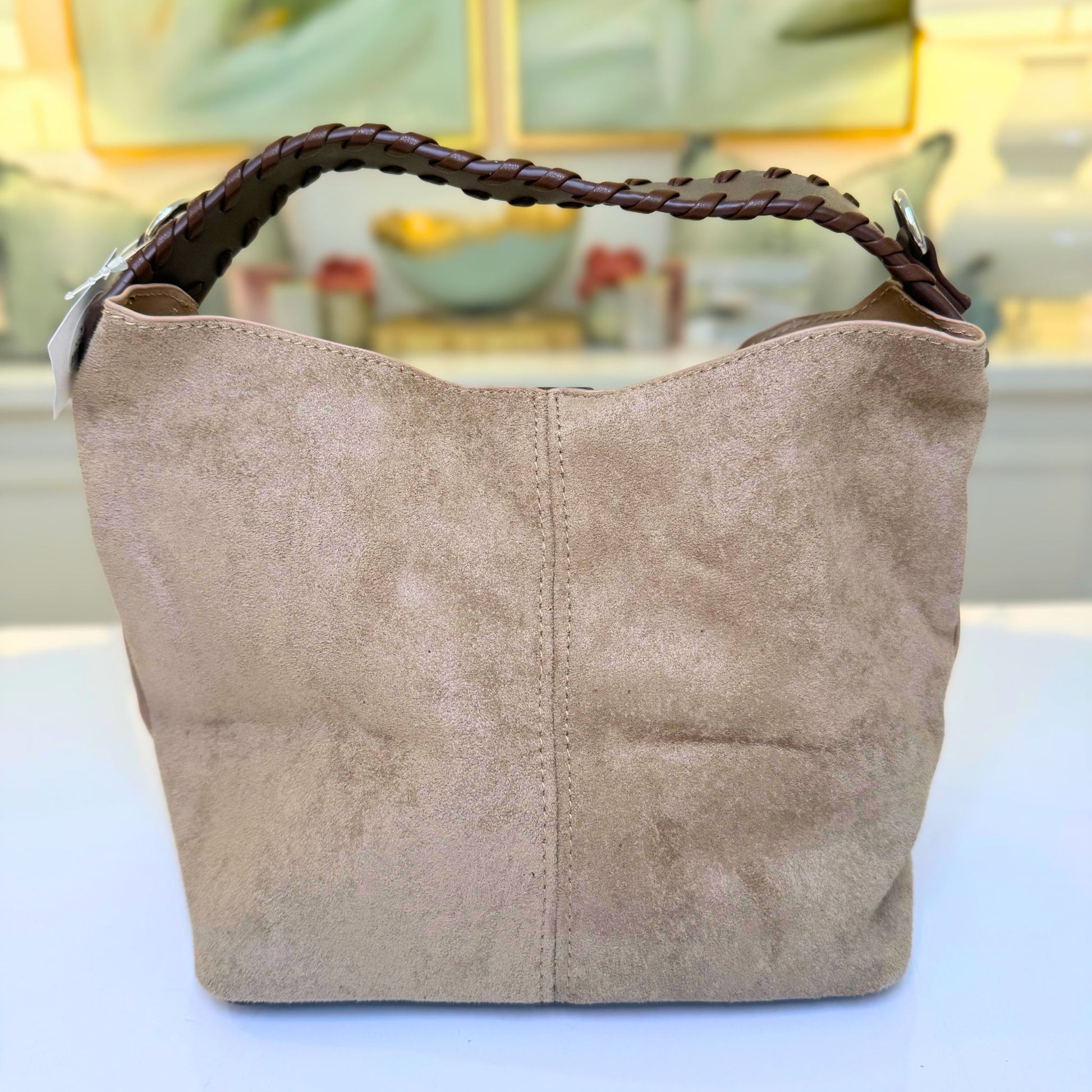 Khaki suede-like microfiber bucket bag with crossbody strap and matching removable pouch