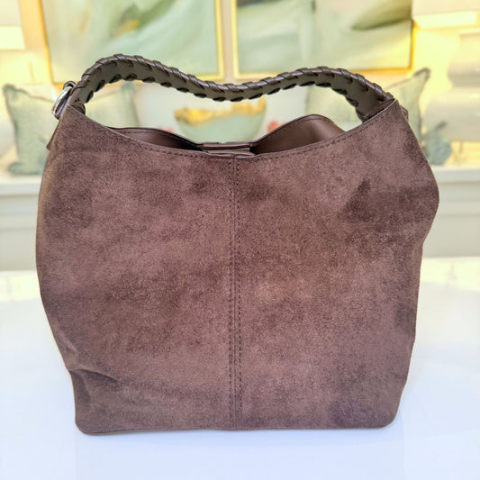 Taupe suede-like microfiber bucket bag with crossbody strap and matching removable pouch