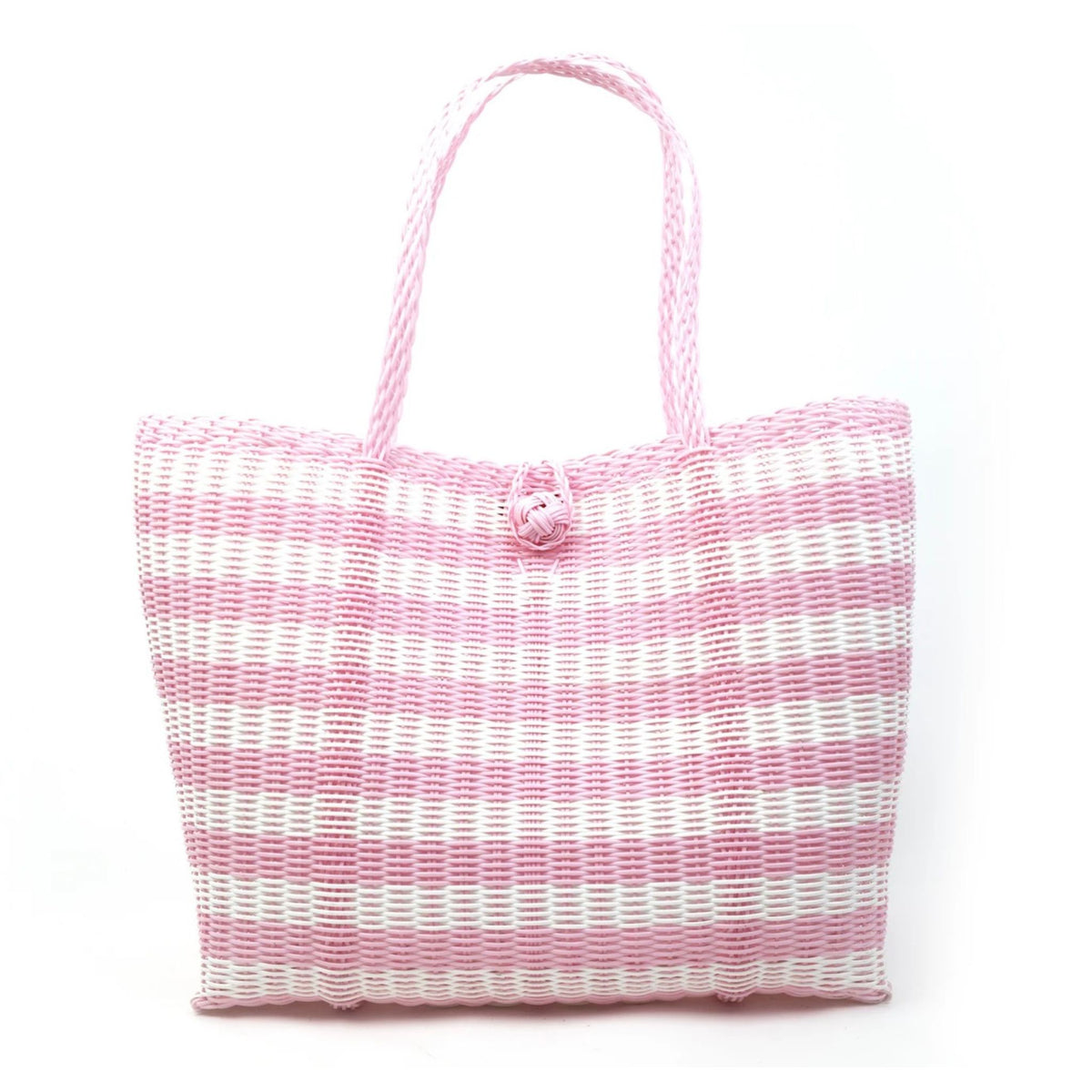 A pink and white woven coated-plastic tote bag with two top handles and a decorative woven flower detail at the top center, shown against a plain white background.