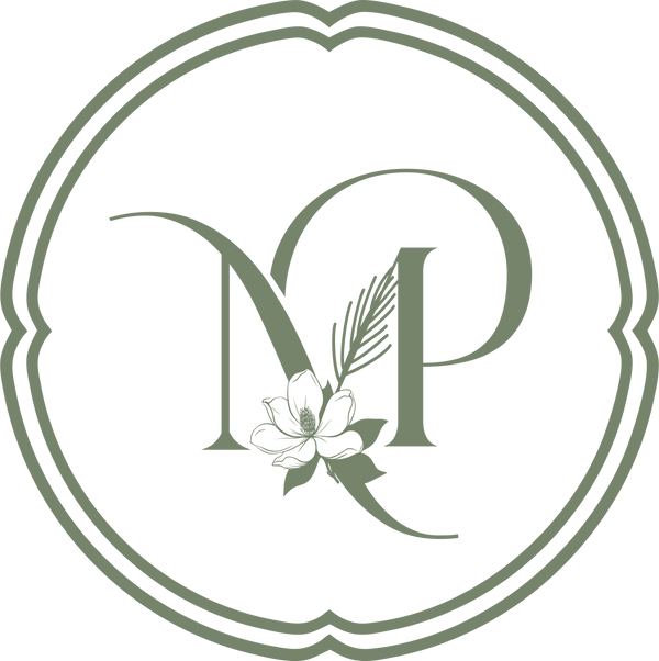 Logo with initials 'MP' and a flower in a circular frame on a white background. The Logo for Magnolia & Pine, a southern boutique and gift store near Lake Martin, Alabama. 