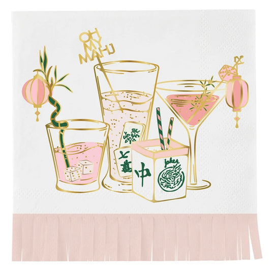 A pink, green, and gold cocktail napkin illustrated with drinks, lanterns, and Asian-inspired botanical motifs, edged in pale pink fringe.