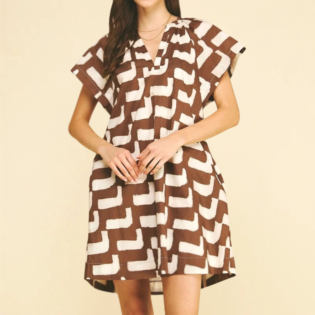 Mini brown geometric print tunic dress, close-up of print detail