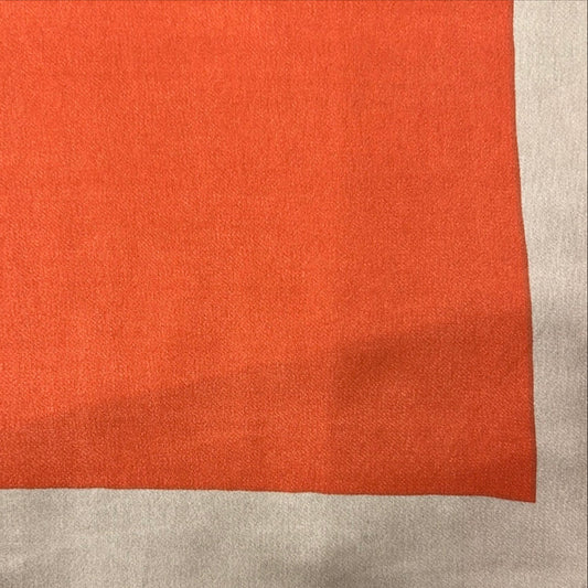 Solid orange and taupe scarf close up