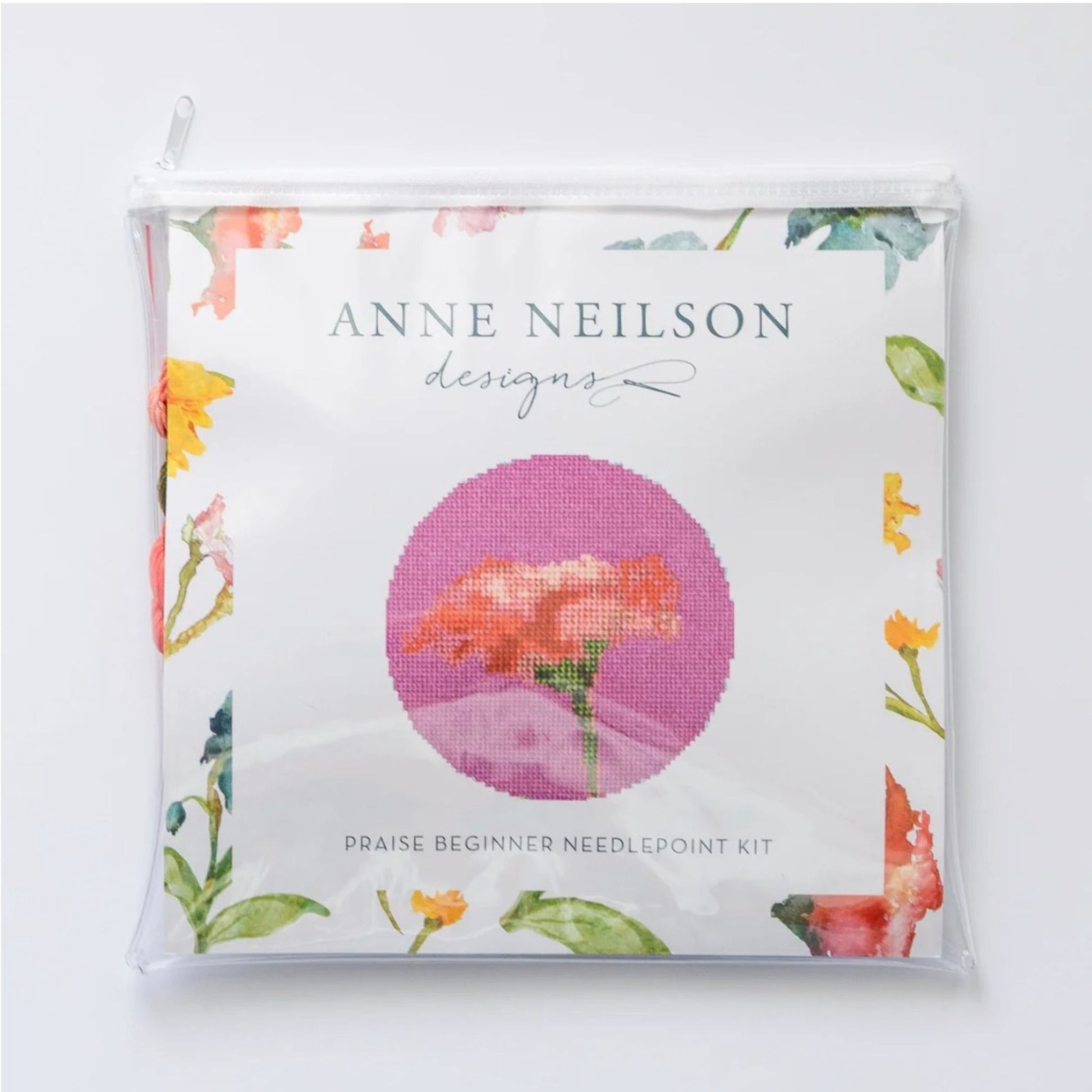Praise Floral Beginner Needlepoint Kit packaging, featuring a coral bloom design on a floral border.