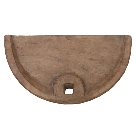 Decorative garden spade made from weathered reclaimed wood, leaning against a wall