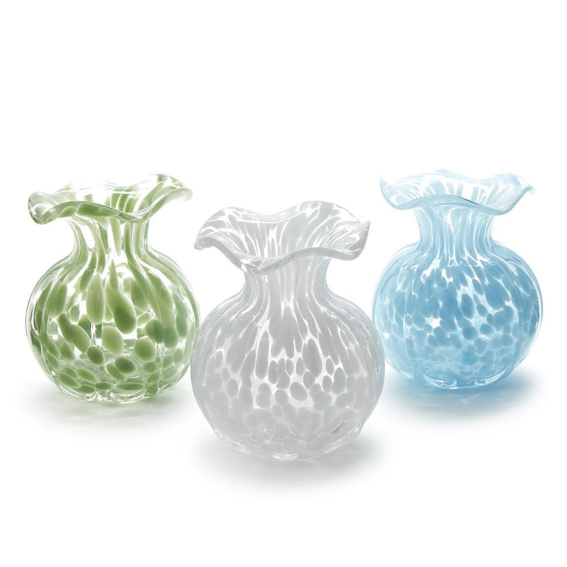 Three glass vases in green, white, and blue on a white background