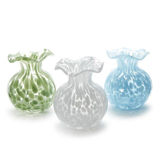 Three glass vases in green, white, and blue on a white background
