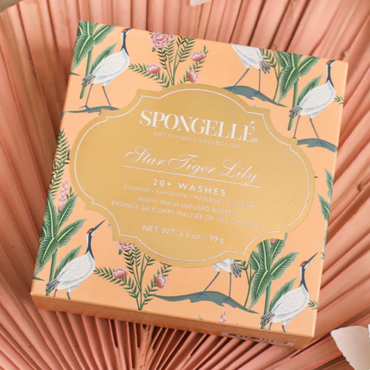 Spongelle soap bar packaging with bird and leaf design on a pink background