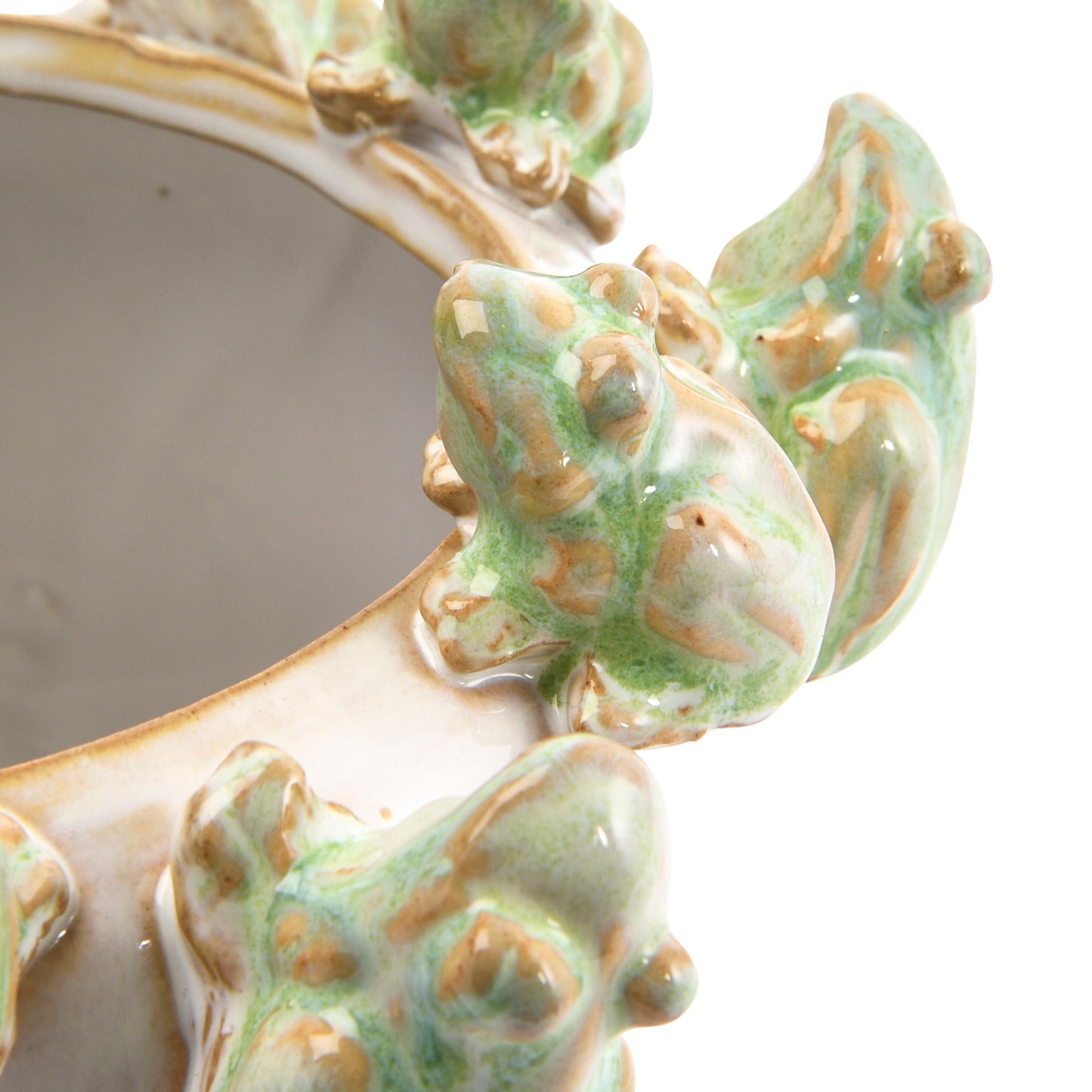 Close-up of the frogs on the rim of the stoneware frog rim planter