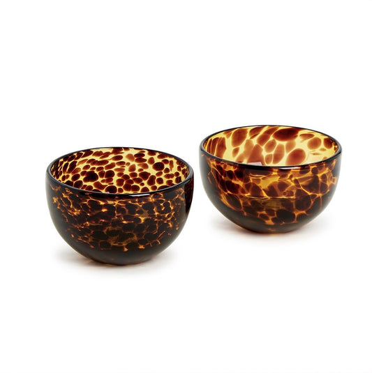Two small decorative bowls with a glossy amber and dark brown tortoiseshell pattern, shown on a clean white background.