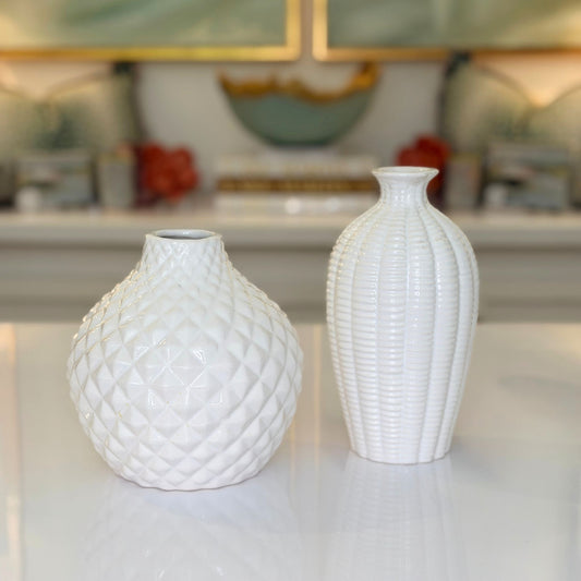 White ceramic textured bud vases, tall and short silhouettes side by side