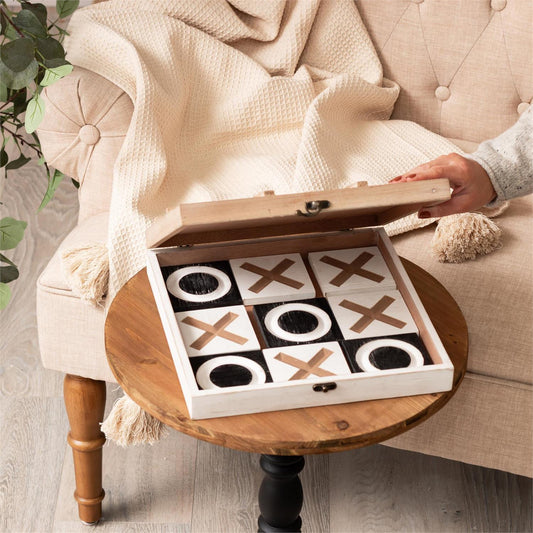 Tabletop tic-tac-toe game set, open showing the checkerboard top
