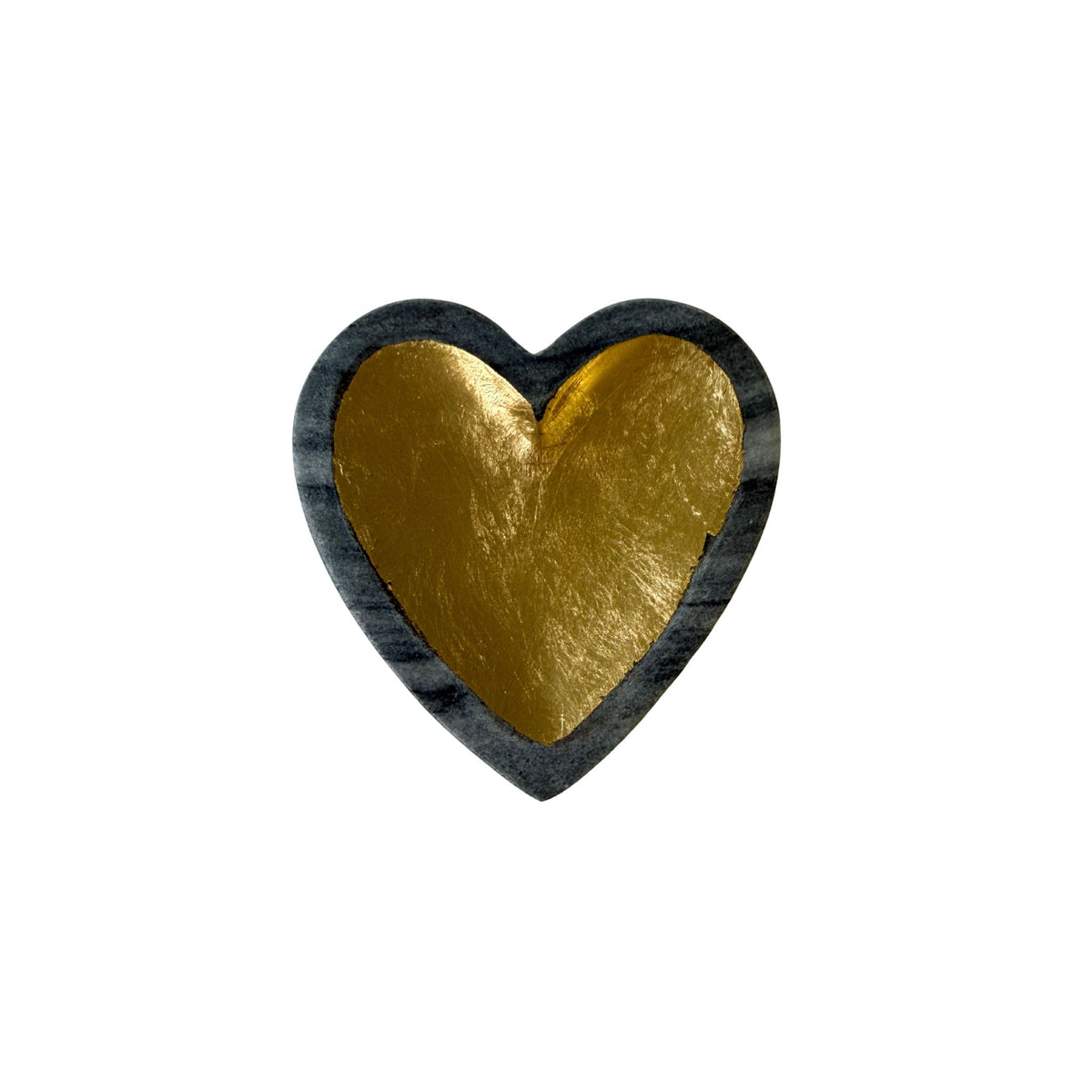 A heart-shaped gray marble dish with a gold-leafed interior.