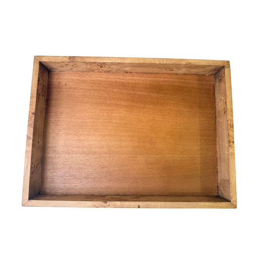A rectangular wood tray with a mahogany-tone interior and a natural burl-wood border.