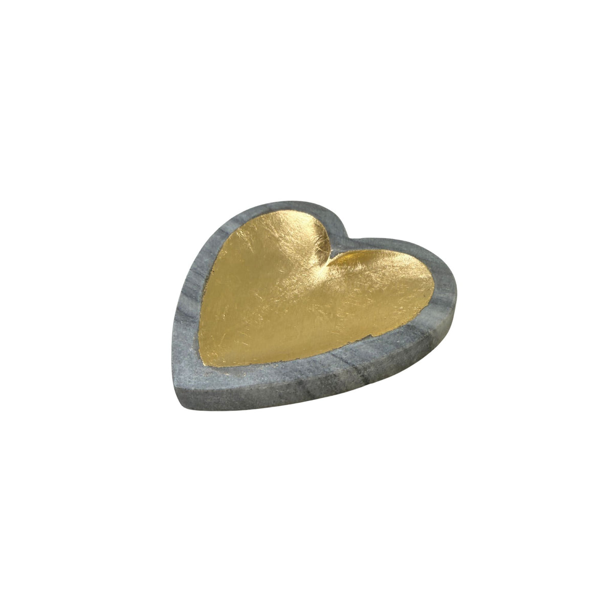 Angled view of a heart-shaped gray marble dish with a gold-leafed interior.